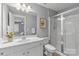 Clean bathroom featuring gray walls, vanity, toilet, and shower with glass door at 1336 Dobson Dr, Waxhaw, NC 28173