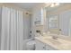 Bright bathroom featuring a vanity, white cabinets, and a shower/tub combination at 1336 Dobson Dr, Waxhaw, NC 28173
