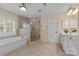 Bathroom featuring a shower, tub, and vanity in a well-lit space at 1336 Dobson Dr, Waxhaw, NC 28173