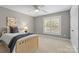 Neutral bedroom featuring a twin bed, carpeted floors, and a window at 1336 Dobson Dr, Waxhaw, NC 28173