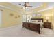 Bright bedroom featuring a ceiling fan, a large bed, and warm neutral tones at 1336 Dobson Dr, Waxhaw, NC 28173