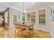 Bright dining room with wood floors and a view of the pool at 1336 Dobson Dr, Waxhaw, NC 28173