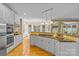 Open kitchen featuring white cabinetry, granite countertops and stainless appliances at 1336 Dobson Dr, Waxhaw, NC 28173