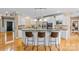 Bright eat-in kitchen with granite countertops, stainless appliances and a breakfast bar with seating at 1336 Dobson Dr, Waxhaw, NC 28173