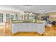 Open kitchen with granite countertops, wood floors and connection to living room at 1336 Dobson Dr, Waxhaw, NC 28173