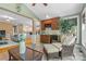 Cozy Living Room featuring tiled floors, built in cabinets, wet bar, and lots of natural light at 1336 Dobson Dr, Waxhaw, NC 28173