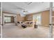 Spacious living room with lots of natural light, a ceiling fan and neutral color palette at 1336 Dobson Dr, Waxhaw, NC 28173