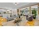 Spacious living area with hardwood floors seamlessly connects to the kitchen and sitting room at 1336 Dobson Dr, Waxhaw, NC 28173