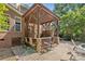 This covered outdoor bar with seating and a grill area is attached to the house and overlooks the pool at 1336 Dobson Dr, Waxhaw, NC 28173