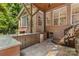 The outdoor kitchen features bar seating, granite countertops, a refrigerator and access to the backyard at 1336 Dobson Dr, Waxhaw, NC 28173