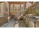 Outdoor kitchen with a stainless steel grill, stone and brick accents and a tile floor at 1336 Dobson Dr, Waxhaw, NC 28173