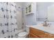Traditional bathroom with shower-tub combo and wood vanity at 137 Citation Dr, Mooresville, NC 28117