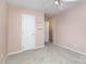 Bedroom with neutral carpet, ceiling fan and door to hallway at 137 Citation Dr, Mooresville, NC 28117