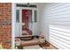 Inviting front entrance with beautiful potted flowers and a storm door at 137 Citation Dr, Mooresville, NC 28117