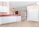 Open kitchen with ample counter space and a view into a living room space at 137 Citation Dr, Mooresville, NC 28117