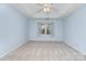 Spacious main bedroom with a tray ceiling, carpeted floor, and natural light at 137 Citation Dr, Mooresville, NC 28117
