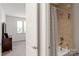 Bathroom featuring bathtub with brown tiled shower and rod at 15018 Marymont Ave, Huntersville, NC 28078