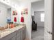 Bathroom with double sinks and granite counters, plus access to the Primary bedroom at 15018 Marymont Ave, Huntersville, NC 28078