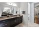 Bathroom featuring a granite countertop vanity with large mirrors and a view of the doorway leading to the toilet at 15018 Marymont Ave, Huntersville, NC 28078