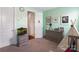 bedroom with light green walls, an aquarium, and a cozy teepee, creating a playful atmosphere at 15018 Marymont Ave, Huntersville, NC 28078