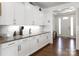 This kitchen showcases white cabinetry, granite countertops, subway tile backsplash and stainless steel appliances at 15018 Marymont Ave, Huntersville, NC 28078