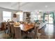 Open concept living area with a dining table, stone fireplace, and comfortable seating at 15018 Marymont Ave, Huntersville, NC 28078