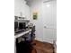 Comfortable home office with a built-in desk, cabinets, and hardwood floors, perfect for remote work at 15018 Marymont Ave, Huntersville, NC 28078