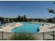 Community pool with sun loungers and mature trees in the background at 15018 Marymont Ave, Huntersville, NC 28078