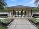 Community clubhouse and pool entrance with beautiful landscaping at 15018 Marymont Ave, Huntersville, NC 28078