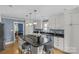 Modern kitchen with stainless steel appliances, a large island with seating, and neutral tones at 1600 Onslow Dr, Charlotte, NC 28205