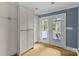 Bright kitchen with ample storage and french doors leading to a cozy porch at 1600 Onslow Dr, Charlotte, NC 28205