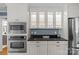 Beautiful kitchen featuring stainless steel appliances, built-in microwave, and ample cabinet storage at 1600 Onslow Dr, Charlotte, NC 28205