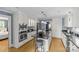 Updated kitchen with stainless steel appliances, a center island with a cooktop, and white cabinetry at 1600 Onslow Dr, Charlotte, NC 28205