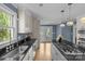 Modern kitchen featuring stainless steel appliances, an island cooktop, and a view to the backyard at 1600 Onslow Dr, Charlotte, NC 28205