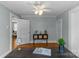 Cozy living room featuring hardwood floors, neutral paint, modern decor, and an open doorway at 1600 Onslow Dr, Charlotte, NC 28205