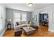 Comfortable living room with hardwood floors, neutral-toned furnishings, and lots of natural light at 1600 Onslow Dr, Charlotte, NC 28205