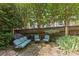 Outdoor patio featuring stone flooring, charming seating arrangement, and well-maintained landscaping, ideal for relaxation and entertainment at 1600 Onslow Dr, Charlotte, NC 28205