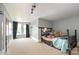 Room featuring gray walls, carpet, natural light, and a black metal bed frame at 1637 N College Ave, Newton, NC 28658