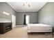 Bedroom featuring carpet, a fireplace, and a window at 1637 N College Ave, Newton, NC 28658
