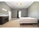 Spacious bedroom featuring neutral walls, carpet, and an electric fireplace adding warmth and comfort at 1637 N College Ave, Newton, NC 28658