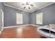 Bedroom featuring wood floors, and two windows at 1637 N College Ave, Newton, NC 28658