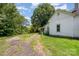 Charming home featuring a cracked driveway and lush green lawn on a sunny day at 1637 N College Ave, Newton, NC 28658