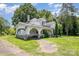 Quaint two-story home with covered porch and mature trees on an expansive lot at 1637 N College Ave, Newton, NC 28658