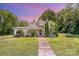 Charming two-story home with landscaped yard and inviting front porch with beautiful color sky at 1637 N College Ave, Newton, NC 28658