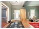Bright living room with hardwood floors, a door with an oval design, and ample natural light at 1637 N College Ave, Newton, NC 28658
