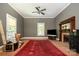 Cozy living room with hardwood floors, fireplace, and large windows with crown molding at 1637 N College Ave, Newton, NC 28658