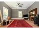 Cozy living room with hardwood floors, fireplace, and large windows with crown molding at 1637 N College Ave, Newton, NC 28658