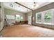 Living room featuring windows and unfinished flooring, ready for personalization at 1637 N College Ave, Newton, NC 28658