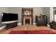 Living room featuring an original fireplace with wood trim and detailed tile surround at 1637 N College Ave, Newton, NC 28658