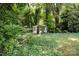 Quaint outbuilding nestled among lush greenery, offering a secluded retreat at 1637 N College Ave, Newton, NC 28658